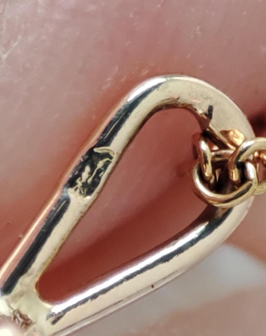 Pendentif ancien en or jaune et blanc 18k Art Déco , plaque d'onyx sertie d'un diamant